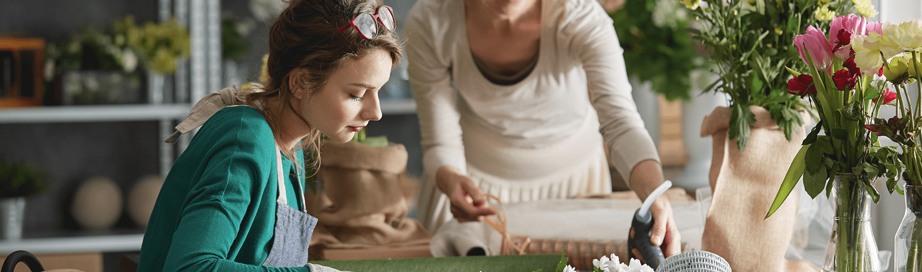 Retail Insurance: A florist creating a bouquet for the shop she works in